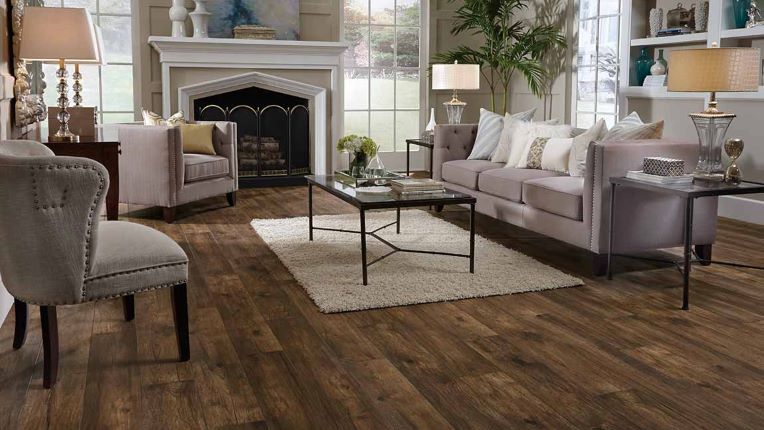 classy wood look laminate flooring in a traditional living room with a fireplace